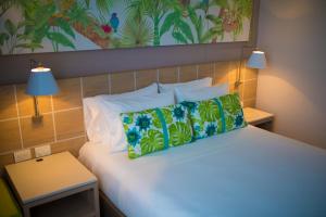 Mia Hotel Choco客房内的一张或多张床位