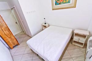 En eller flere senge i et værelse på ipanema 50m da praia com garagem