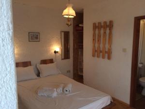 A bed or beds in a room at Casa Lambuh