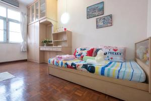 a bedroom with a bed with toys on it at •Lovely Home•11Pax+4Bedrooms+Themed•Bukit Mertajam in Bukit Mertajam