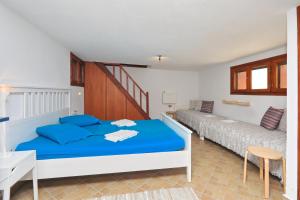 Katil atau katil-katil dalam bilik di Cambos Villa