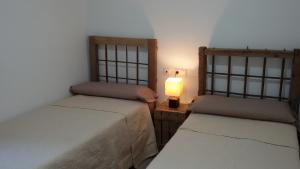 A bed or beds in a room at Casa Rural Las Camilas- Sierra de Alcaraz