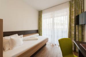 Postel nebo postele na pokoji v ubytování Alpinhotel Monte Superior - Silvretta Card Premium Betrieb