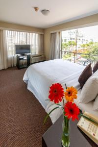 מיטה או מיטות בחדר ב-Roosevelt Hotel & Suites