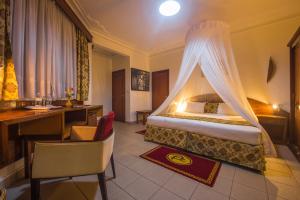 Ein Bett oder Betten in einem Zimmer der Unterkunft Hotel Chez Lando