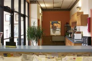 a kitchen with a blue counter in a room at Lodi Valley Suites in Lodi