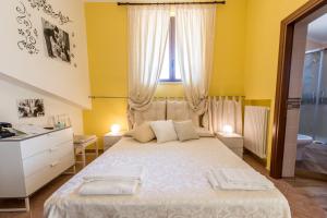 Posteľ alebo postele v izbe v ubytovaní B&B UN'ALTRA VITA
