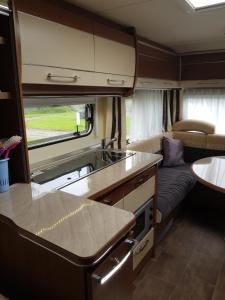 a kitchen and living room in an rv at Camp Saltstraumen-Elvegård in Bodø +177 photos