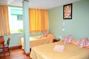 Katil atau katil-katil dalam bilik di Hostal Terra 2 - EL CONDADO