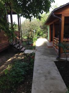 a walkway outside of a house with a porch at Guest yard «Moonlight» in Gagra