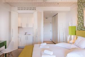 Ένα ή περισσότερα κρεβάτια σε δωμάτιο στο Salvator Villas & Spa Hotel 