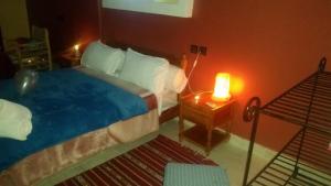 Postel nebo postele na pokoji v ubytování Kasbah Restaurant Amazir