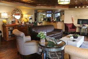 a living room with a couch and a table at Historian Inn in Gardnerville
