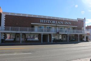 
a large building with a sign on the side of it at Historian Inn in Gardnerville
