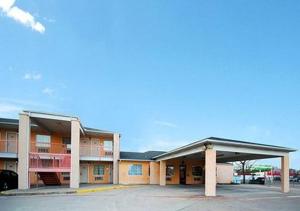 an empty parking lot in front of a building at Nites Inn in Killeen