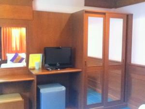 A television and/or entertainment centre at Rin Beach Resort