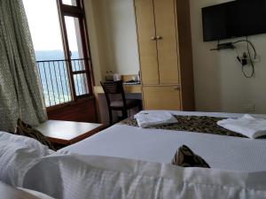 Hotel Ninamma客房内的一张或多张床位
