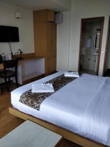 Hotel Ninamma客房内的一张或多张床位