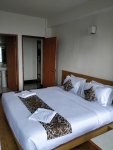 Hotel Ninamma客房内的一张或多张床位