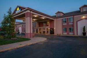 a hotel with a parking lot in front of it at Days Inn by Wyndham Pauls Valley in Pauls Valley
