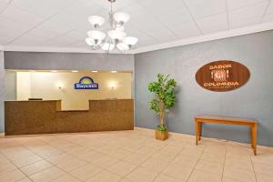 a lobby of a hospital with a sign on the wall at Days Inn by Wyndham Orlando Airport Florida Mall in Orlando