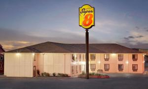 a sign for a super motel in front of a building at Super 8 by Wyndham Rock Port MO in Rock Port