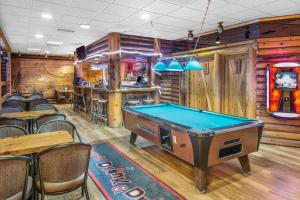 a bar with a pool table in a restaurant at Super 8 by Wyndham Innisfail in Innisfail