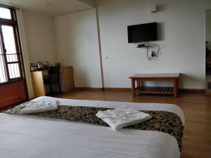 Hotel Ninamma客房内的一张或多张床位