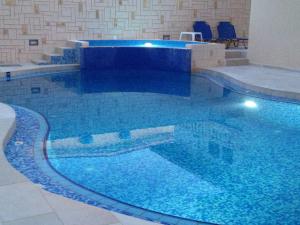 The swimming pool at or close to Angelica Studios and Apartments
