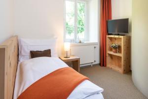 Łóżko lub łóżka w pokoju w obiekcie Hotel Donatz