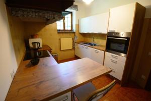 a kitchen with a wooden counter top in a room at Gaber B&B in Gabrovizza San Primo