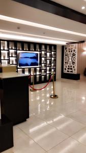 a lobby with a flat screen tv on a wall at مساس الخليج Mesas Gulf وحدات سكنية in Dammam