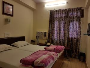 Postel nebo postele na pokoji v ubytování Hotel Sweet Dream