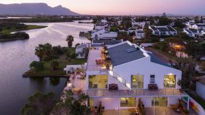 an aerial view of a house on the water at Marina Views in Muizenberg