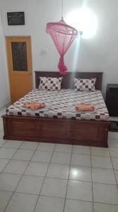 Postel nebo postele na pokoji v ubytování Tamaro Beach Resort