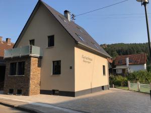 a building with the words patriarchy therapy written on it at Ferienhaus Neumeyer in Schönau