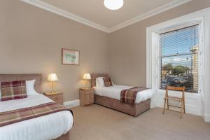 Cama ou camas em um quarto em Sea Breeze - Donnini Apartments