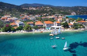 an aerial view of a beach with boats in the water at Eleana Boutique Hotel & Blue Infinity in Nikiana