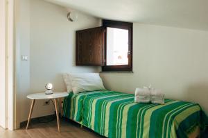 
Letto o letti in una camera di AlbaChiara appartamento con terrazza
