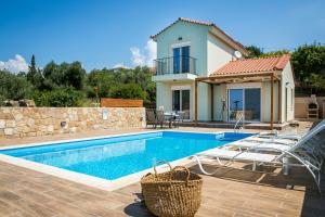 a swimming pool in front of a villa at Villa SeaBreeze in Minia