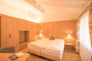 Postel nebo postele na pokoji v ubytování Hotel La Romantica