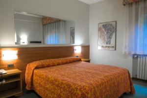 Кровать или кровати в номере Ilgo Hotel