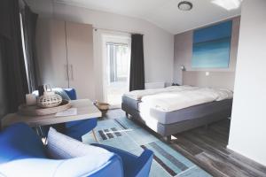 Postel nebo postele na pokoji v ubytování Lodgepark Goitzsche GmbH