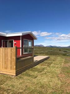 a rendering of a tiny house in a field w obiekcie Blue View Cabin 1B With private hot tub w mieście Reykholt