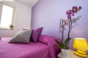 Postel nebo postele na pokoji v ubytování B&B Villa Eleonora