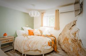 a bedroom with a white bedspread and pillows at EL TORREON 109 CHARMING B&B - Recomendado Adultos in Frigiliana