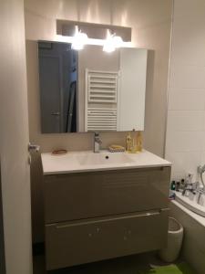 a bathroom with a sink and a mirror at casaisabel in Bordeaux +16 photos