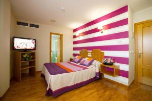 Postel nebo postele na pokoji v ubytování Hotel Río Cabia