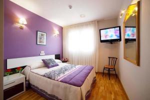 Postel nebo postele na pokoji v ubytování Hotel Río Cabia