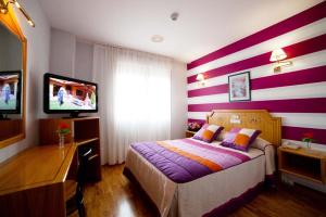 Postel nebo postele na pokoji v ubytování Hotel Río Cabia